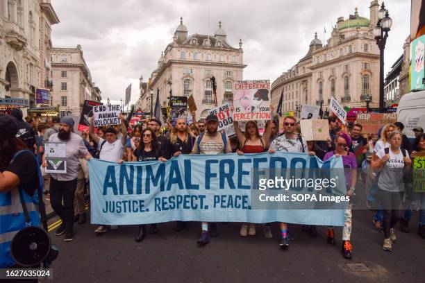 Protesters hold an 'Animal freedom' banner during the demonstration in Piccadilly Circus. Crowds marched through central London during the National...