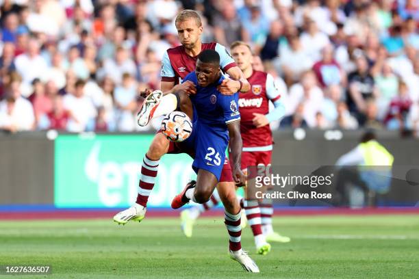 Moises Caicedo of Chelsea is challenged by Tomas Soucek of West Ham United during the Premier League match between West Ham United and Chelsea FC at...