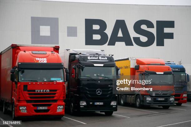 Trucks sit in parking bays outside a distribution warehouse at BASF SE's headquarters in Ludwigshafen, Germany, on Tuesday, Feb. 26, 2013. BASF SE...