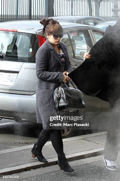 Singer Lily Allen is sighted arriving at the 'Angelina' tea room on February 26, 2013 in Paris, France.