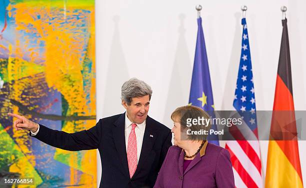 Secretary of State John Kerry and German Chancellor Angela Merkel are seen prior to giving a statement to the press on February 26, 2013 in Berlin,...
