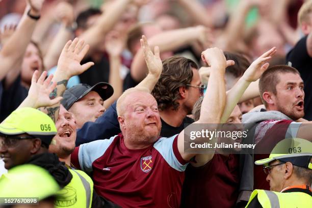 Fans of West Ham United celebrate during the Premier League match between West Ham United and Chelsea FC at London Stadium on August 20, 2023 in...