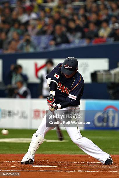 Outfielder Katsuya Kakunaka of Japan at bat during the friendly game between Hanshin Tigers and Japan at Kyocera Dome Osaka on February 26, 2013 in...