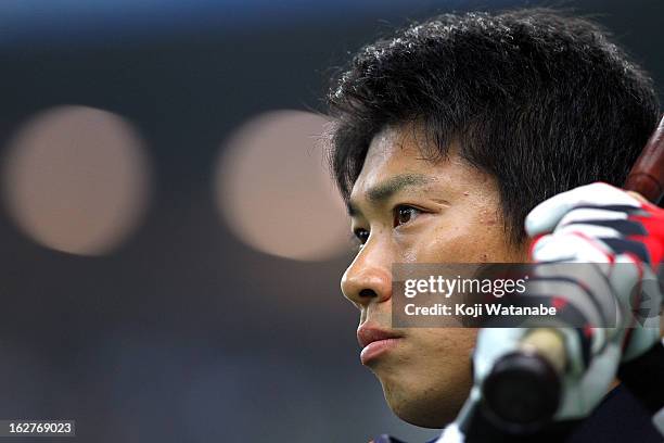 Outfielder Katsuya Kakunaka of Japan looks on during the friendly game between Hanshin Tigers and Japan at Kyocera Dome Osaka on February 26, 2013 in...