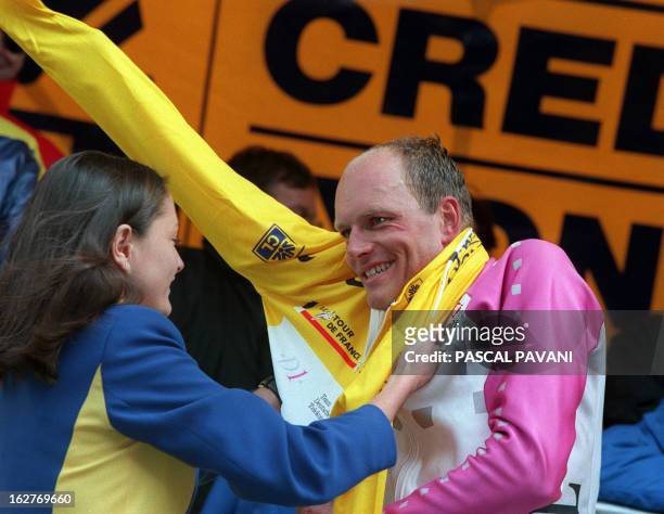 File picture dated 08 july 1996 shows Bjarne Riis from Denmark as he puts on the yellow jersey of the overall leader of the Tour de France after he...