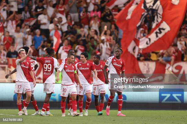 Takumi Minamino of AS Monaco celebrates with teammates after scoring his second goal during the Ligue 1 Uber Eats match between AS Monaco and RC...