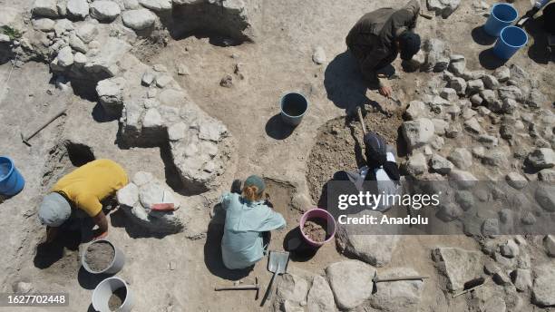An aerial view of archeologists working on the excavation operation area, aiming to find remains from the Iron Age, conducted by Turkish Ministry of...