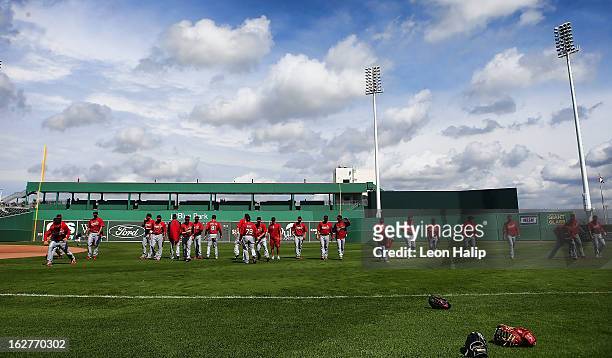 Members of the St. Louis Cardinals warm up prior to the start of the game against the Boston Red Sox at JetBlue Park on February 26, 2013 in Fort...