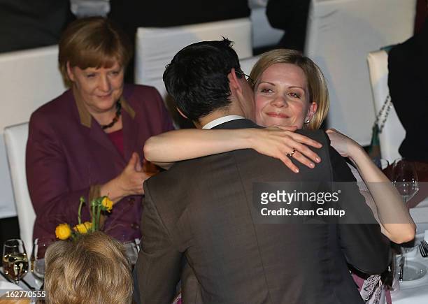 Philipp Roesler, Vice Chancellor and Chairman of the German Free Democrats , embraces his wife Wiebke as German Chancellor and Chairwoman of the...