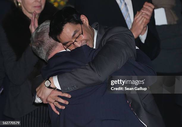 Philipp Roesler, Vice Chancellor and Chairman of the German Free Democrats , embraces his adoptive father Uwe after Philipp spoke at his 40th...