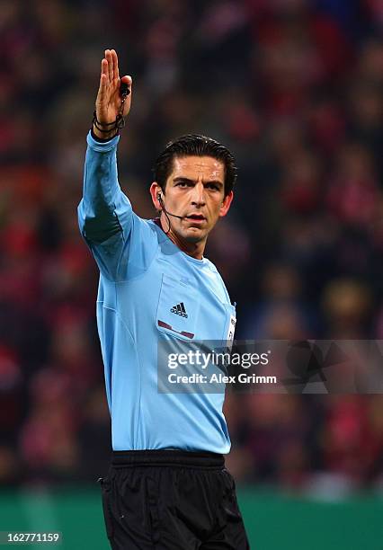 Referee Deniz Aytekin gestures during the DFB Cup Quarter Final match between FSV Mainz 05 and SC Freiburg at Coface Arena on February 26, 2013 in...