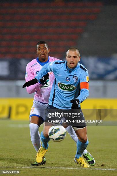 Le Havre's French forward Yohann Riviere vies with Evian's Ghanaian midfielder Mohammed Rabiu during a French Cup football match Evian vs Le Havre on...