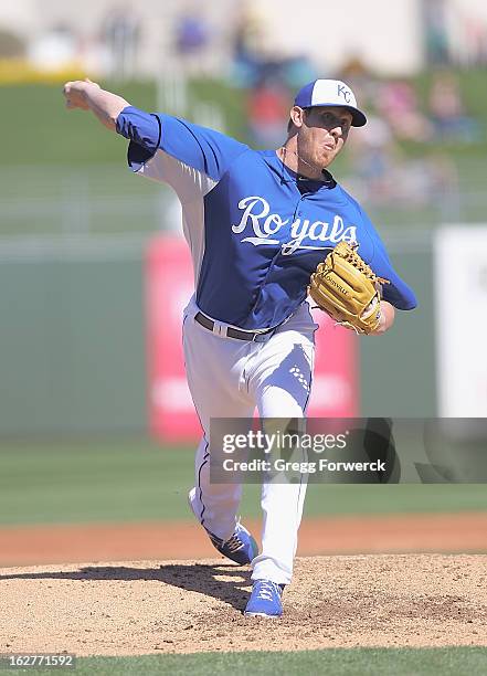 Nate Adcock of the Kansas City Royals pitches against the Arizona Diamondbacks during a spring training baseball game at Surprise Stadium on February...