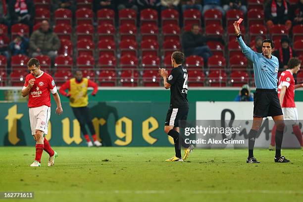 Zdenek Pospech of Mainz is sent of Offenbach by referee Deniz Aytekin during the DFB Cup Quarter Final match between FSV Mainz 05 and SC Freiburg at...