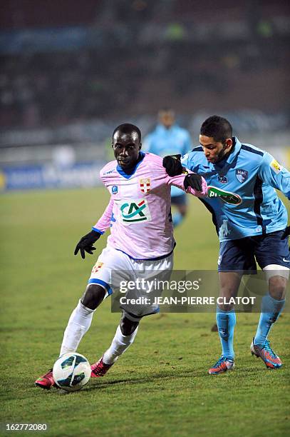 Evian's Ghanaian midfielder Mohammed Rabiu vies with Le Havre's French defender Jerome Mombris during a French Cup football match Evian vs Le Havre...
