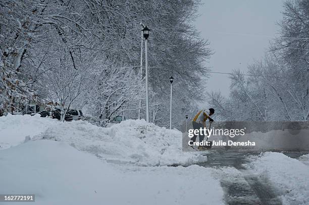 Residents begin the process of digging out after a snowstorm hit the midwest February 26, 2013 in Merriam, Kansas. This is the second major snowstorm...