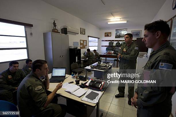 Members of the Uruguayan Air Force talk at the Brigade 1 headquarters in Montevideo, Uruguay on February 26, 2013. AFP PHOTO/Mario Goldman