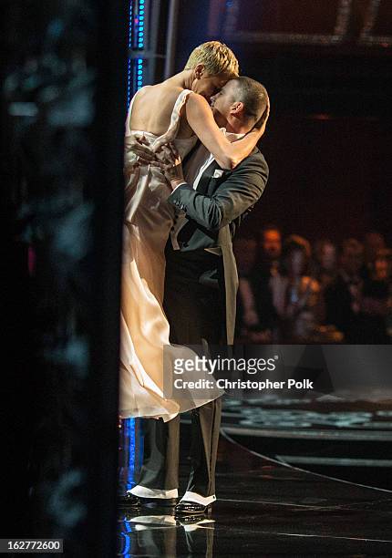 Actors Channing Tatum and Charlize Theron dance onstage, seen from backstage during the Oscars held at the Dolby Theatre on February 24, 2013 in...