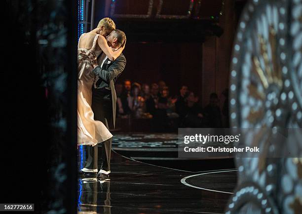 Actors Channing Tatum and Charlize Theron dance onstage, seen from backstage during the Oscars held at the Dolby Theatre on February 24, 2013 in...