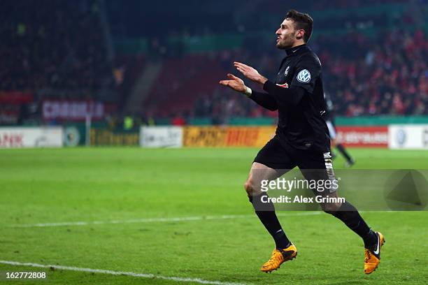 Daniel Caligiuri of Freiburg celebrates his team's third goal during the DFB Cup Quarter Final match between FSV Mainz 05 and SC Freiburg at Coface...