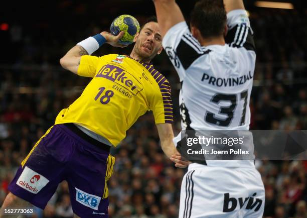 Iker Romero Fernandez of Berlin is challenged by Momir Ilic of Kiel during the DKB Handball Bundesliga match between THW Kiel and Fuechse Berlin at...
