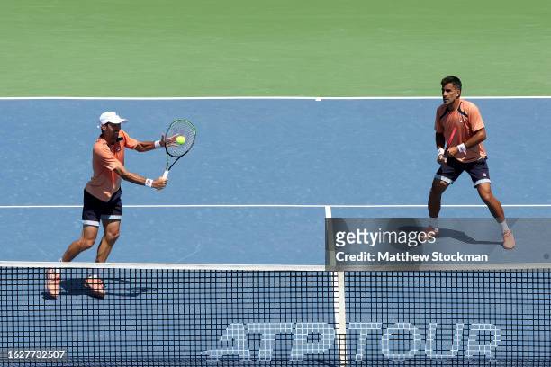 Andres Molteni and Maximo Gonzalez of Argentina play Jamie Murray of Great Britain and Michael Venus of New Zealand during the doubles final of the...