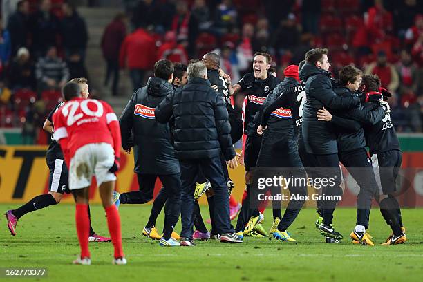 Players of Freiburg celebrate after the DFB Cup Quarter Final match between FSV Mainz 05 and SC Freiburg at Coface Arena on February 26, 2013 in...