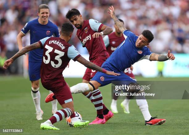 Emerson Palmieri of West Ham United is challenged by Enzo Fernandez of Chelsea during the Premier League match between West Ham United and Chelsea FC...