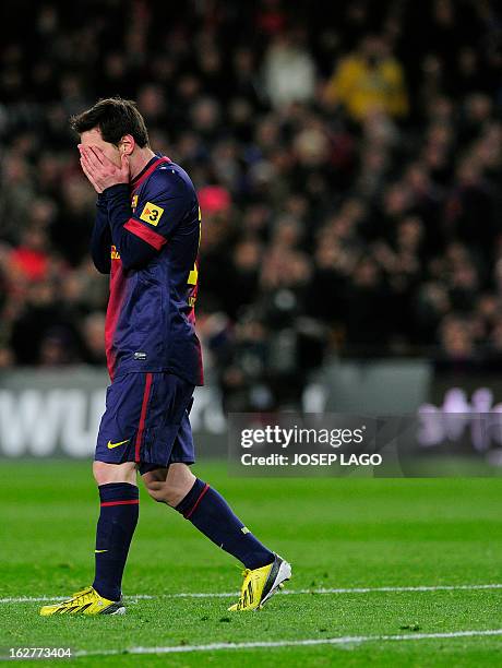 Barcelona's Argentinian forward Lionel Messi reacts during the Spanish Cup semi-final second-leg football match FC Barcelona vs Real Madrid CF at the...