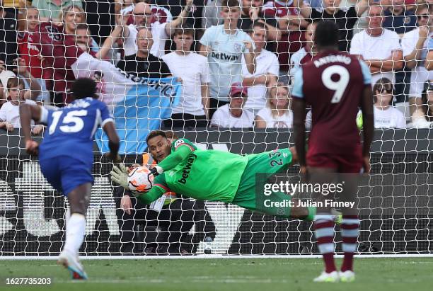 Alphonse Areola of West Ham United saves a penalty from Enzo Fernandez of Chelsea during the Premier League match between West Ham United and Chelsea...