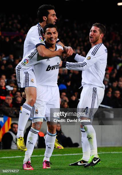 Cristiano Ronaldo of Real Madrid CF celebrates with his team-mates Alvaro Arbeloa and Sergio Ramos after scoring their second goal during the Copa...