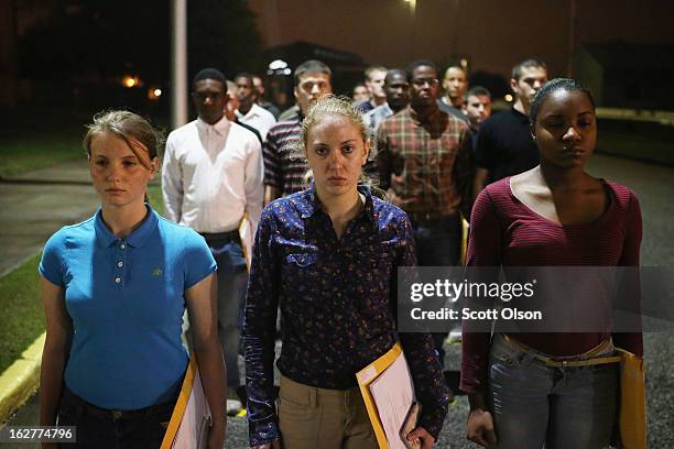 Male and female Marine recruits arrive for boot camp on February 25, 2013 at MCRD Parris Island, South Carolina. Female enlisted Marines have gone...