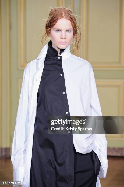 Model walks the runway during the Moon Young Hee Fall/Winter 2013/14 Ready-to-Wear show as part of Paris Fashion Week at Hotel de Varengeville on...