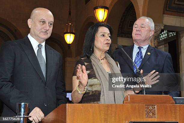 Actor Anupam Kher is presented with the Los Angeles City Proclamation by Councilmember Tom Labonge with author Mira Honeycutt at Los Angeles City...