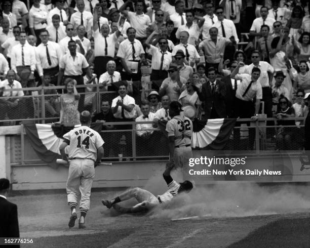Baseball All-Star Game 1964 - Willie is home in a game-tying cloud of dust. Howard looks at throw from Joe Pepitone: it bounced out of control on...