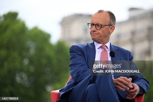 Leader of Germany's Christian Democratic Union Friedrich Merz waits for the recording of his summer interview with German public broadcaster ARD in...
