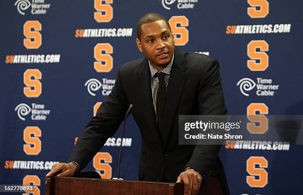 Former Syracuse Orange player Carmelo Anthony speaks during a press conference after his jersey was retired during a half time presentation in the...