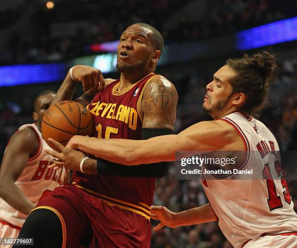 Marreese Speights of the Cleveland Cavaliers is fouled by Joakim Noah of the Chicago Bulls at the United Center on February 26, 2013 in Chicago,...