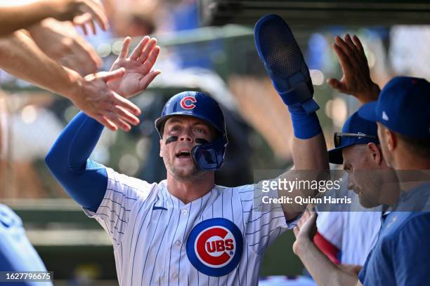 Nico Hoerner of the Chicago Cubs celebrates after scoring in the first inning against the Kansas City Royals at Wrigley Field on August 20, 2023 in...