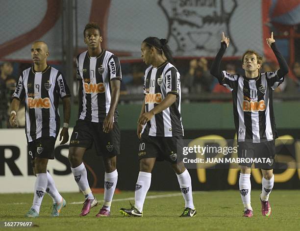 Brazil's Atletico Mineiro forward Bernard celebrates after scoring his second team's third goal against Argentina's Arsenal FC during their Copa...