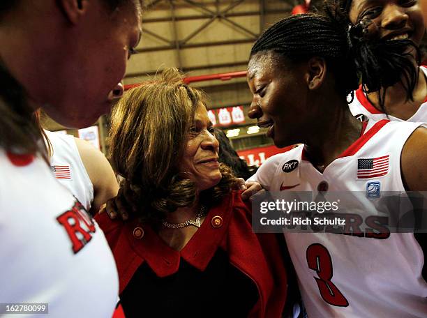 Head coach C. Vivian Stringer of the Rutgers Scarlet Knights is congratulated by Erica Wheeler after defeating the South Florida Bulls 68-56 in a...