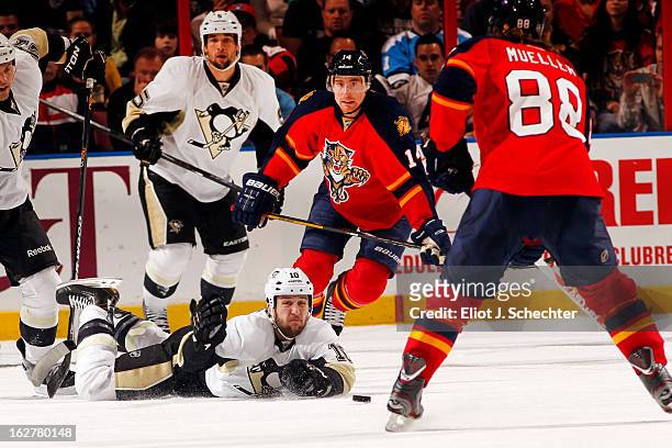 Tanner Glass of the Pittsburg Penguins dives to block a shot from Peter Mueller of the Florida Panthers at the BB&T Center on February 26, 2013 in...