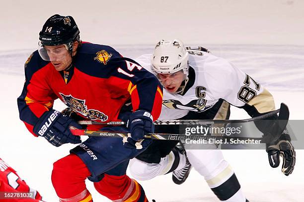 Tomas Fleischmann of the Florida Panthers tangles with Sidney Crosby of the Pittsburgh Penguins at the BB&T Center on February 26, 2013 in Sunrise,...