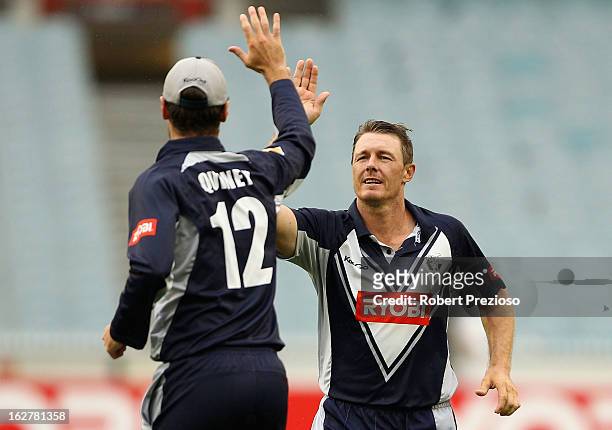 Darren Pattinson of the Bushrangers celebrates with Rob Quiney of the Bushrangers the wicket of Luke Pomersbach of the Bulls during the Ryobi One Day...