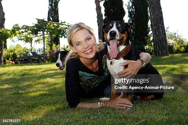 Nina Ruge and her dogs 'Lupo' and 'Simba' on July 15, 2010 in Lucca, Italy.