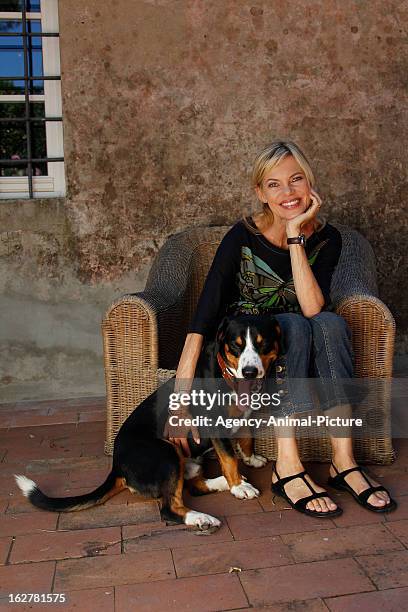 Nina Ruge and her dog 'Lupo' on July 15, 2010 in Lucca, Italy.