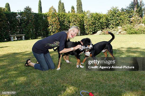 Nina Ruge and her dogs 'Lupo' and 'Simba' on July 15, 2010 in Lucca, Italy.
