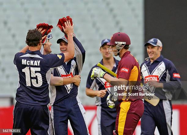 Clint McKay and Peter Handscomb of the Bushrangers celebrate after dismissing Greg Moller of the Bulls during the Ryobi One Day Cup final match...