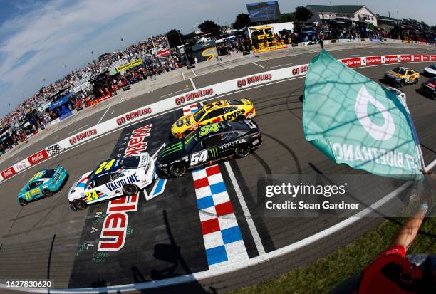 Denny Hamlin, driver of the Mavis Tires & Brakes Toyota, leads the field to the green flag to start the NASCAR Cup Series Go Bowling at The Glen at...