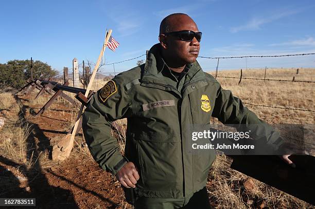 Border Patrol agent Shelton McKenzie stands at the U.S.-Mexico border on February 26, 2013 near Sonoita, Arizona. The Federal government has...